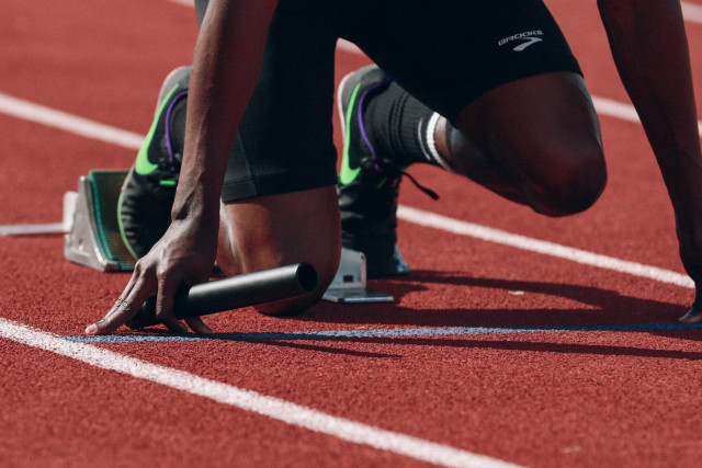 Athlete on cinder track